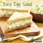 Egg salad sandwiches on a cutting board