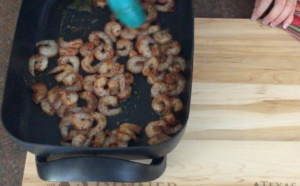image of shrimp tacos on a skillet at the beginning of cooking