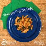 Spinach Pasta Toss recipe plated on a blue plate