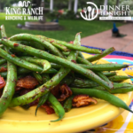 Spiced green beans resting on a plate.