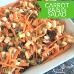 Carrot Raising Salad recipe plated in a white serving dish, ready for your dinner table!