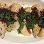 This picture shows chicken tenderloins covered with the blackberry chipotle sauce.