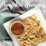 Pumpkin Hummus recipe, plated with pita chips on a white plate and light green napkin.