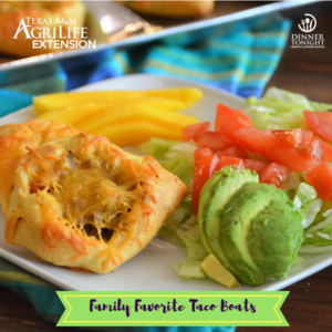 Dinner Tonight recipe Taco Boats. Ground beef baked in a crescent roll topped with cheddar cheese. Plated with a salad.