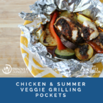 Chicken and vegetables still in their grilling packet, on a yellow plate ready to be served.