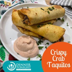 two Crispy Crab Taquitos and crema.